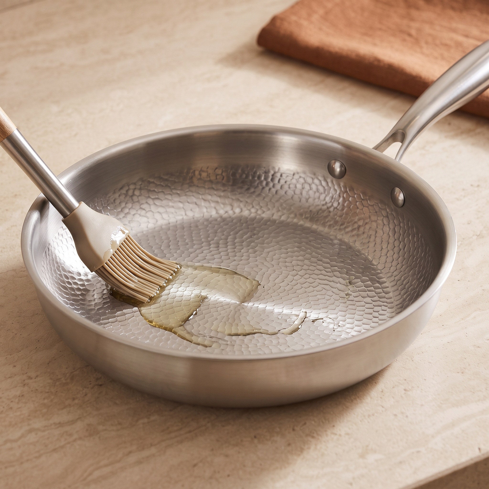 Close view of the hammered surface with a small pool of cooking oil