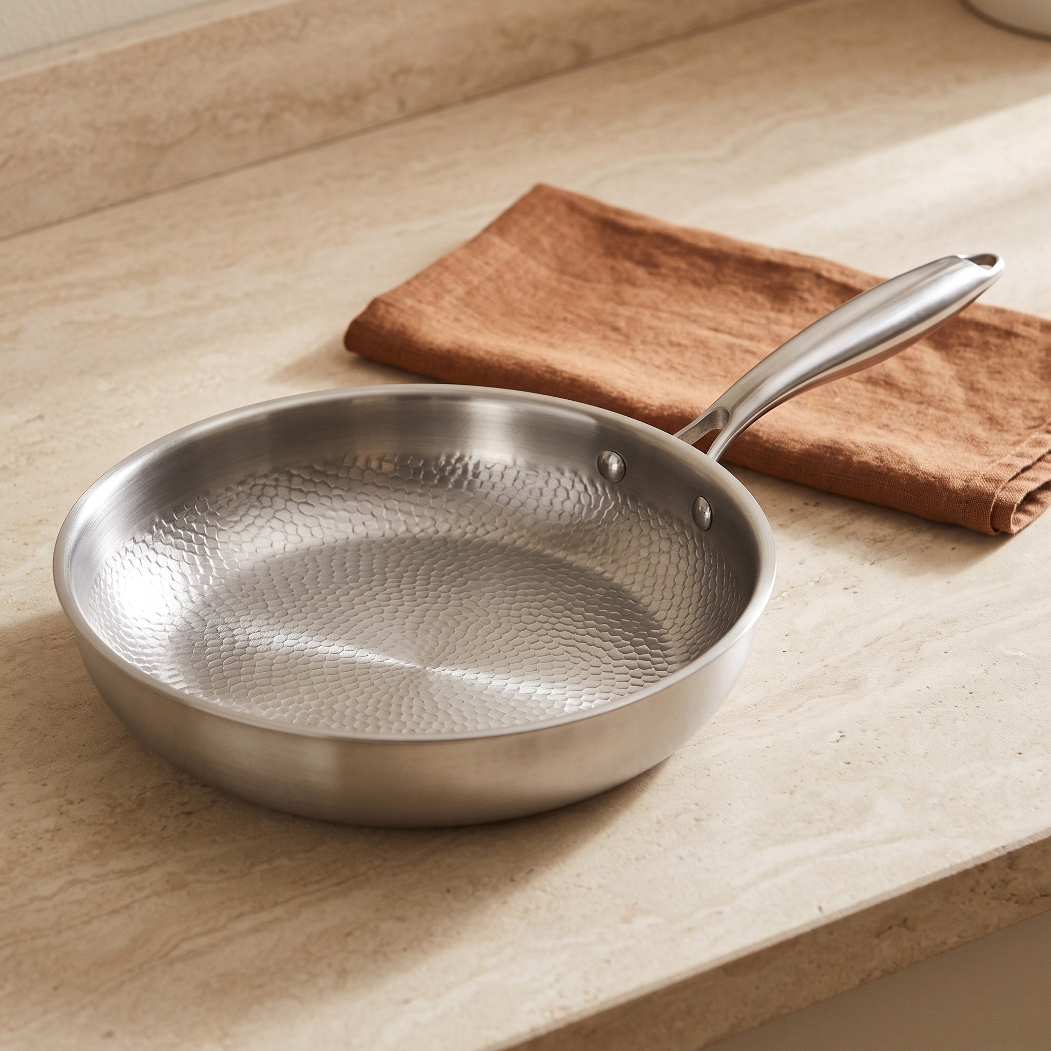 Whole hammered pan on an ivory counter