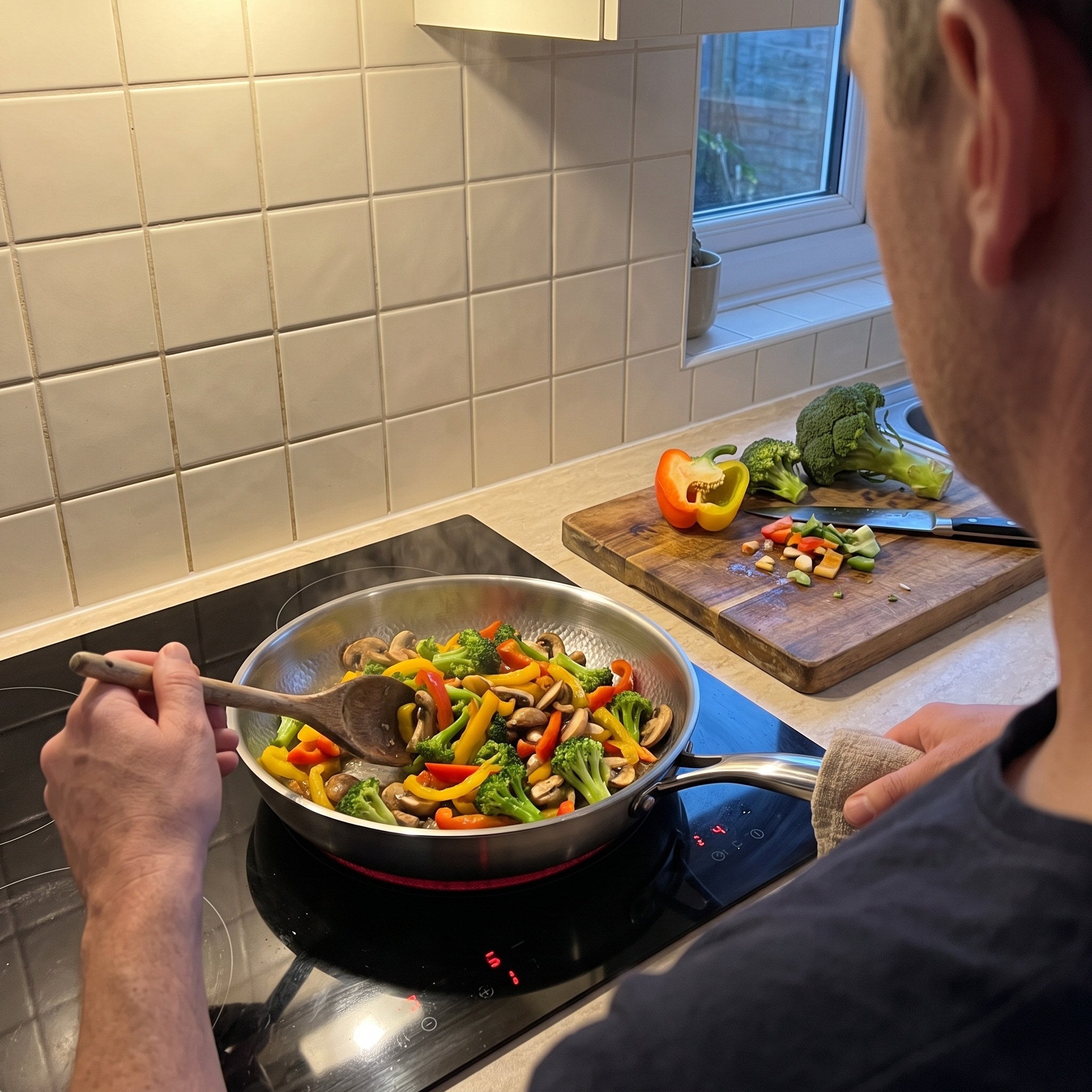 Vegetable stir-fry in a hammered pan on induction
